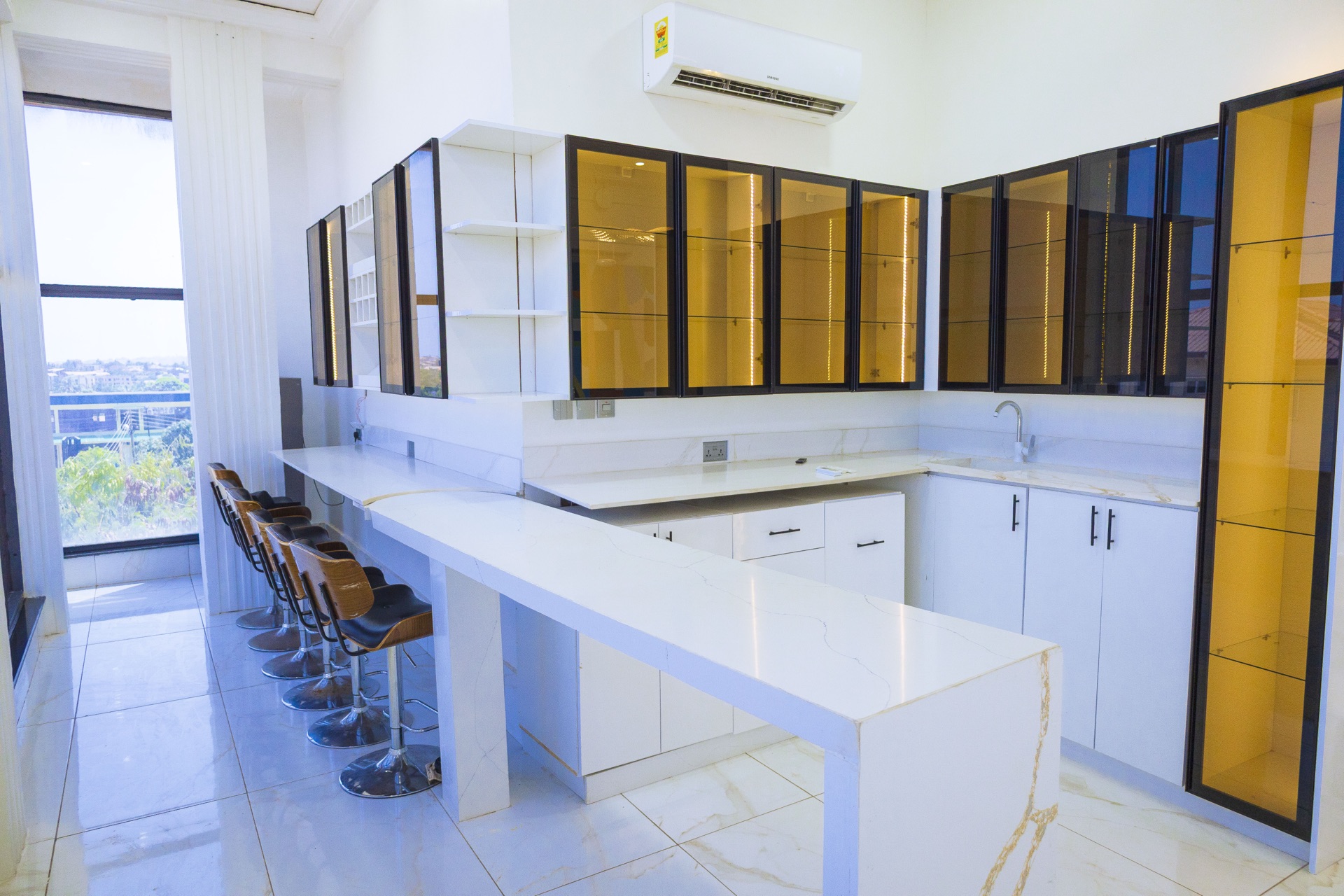 Open chef's kitchen with island and breakfast bar
